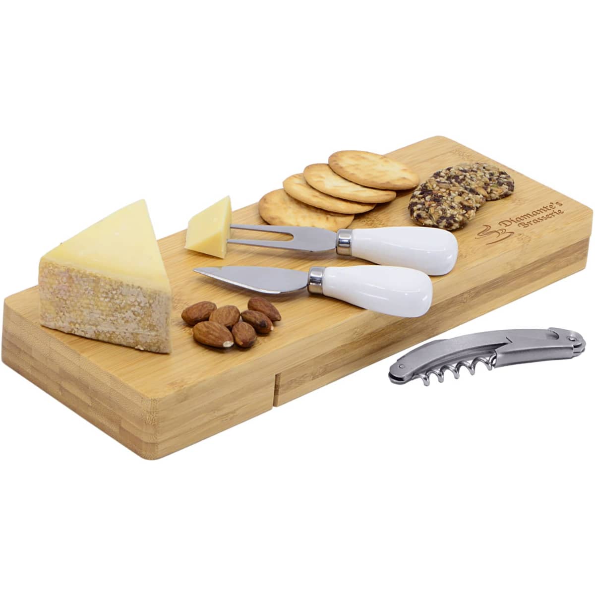 A bamboo cheese board featuring cheese wedges, crackers, almonds, and three cheese knives with white handles.