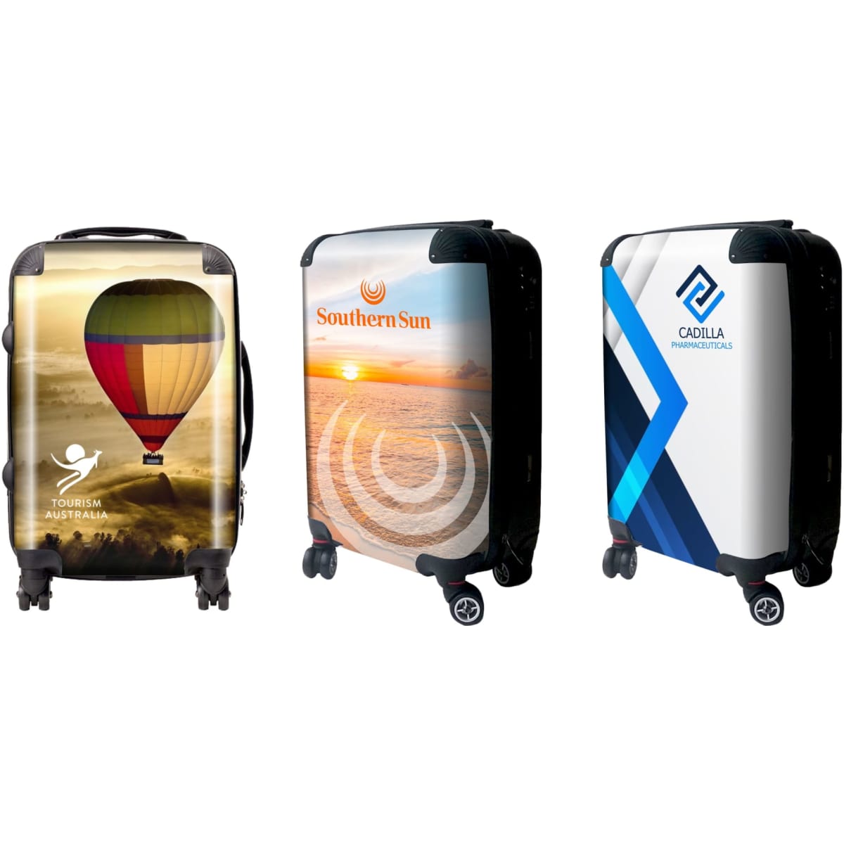 Three wheeled carry-on suitcases featuring colourful designs, including a hot air balloon, sunset, and abstract patterns.