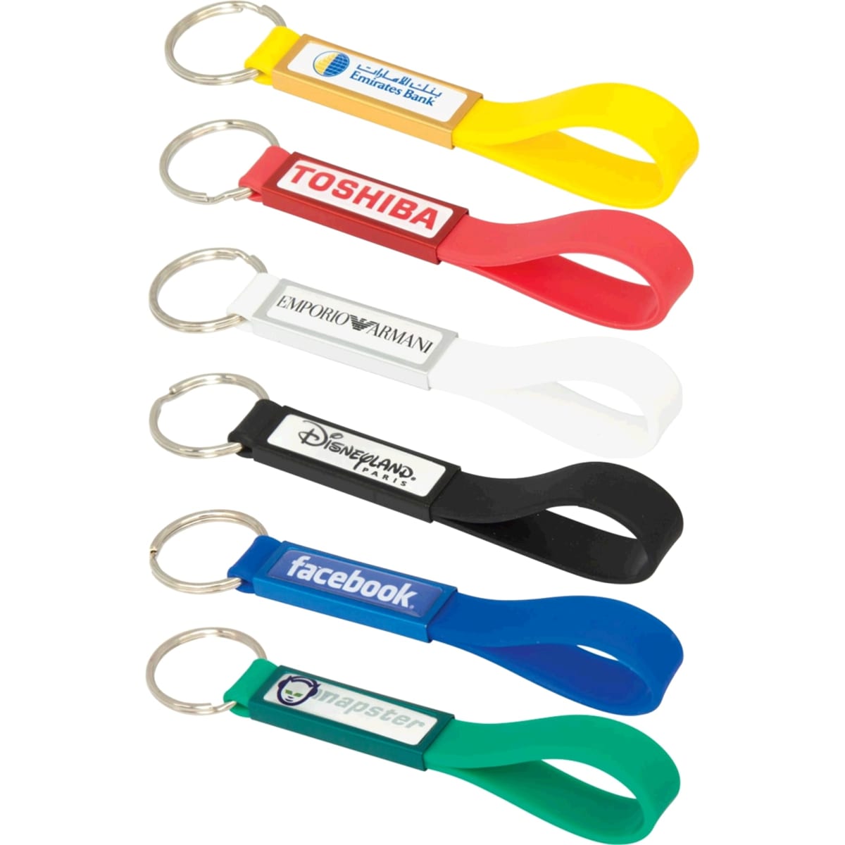A collection of silicone sling keyrings in various colours, featuring different branding and a dome-indent design.