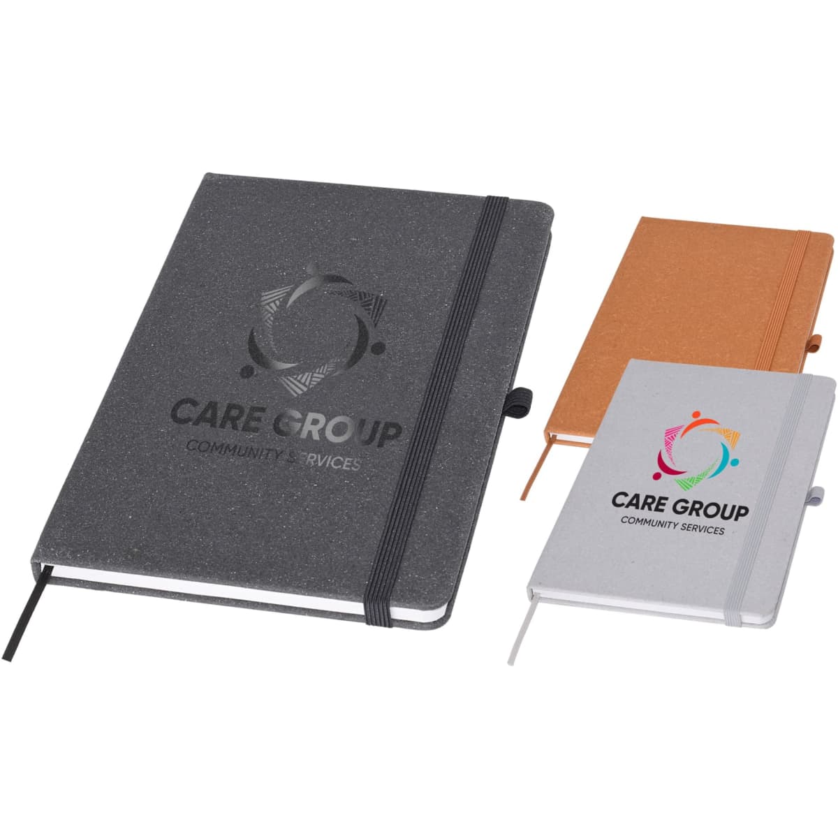 Three A5 notebooks in grey, orange, and white, featuring a logo on the covers and an elastic band closure.