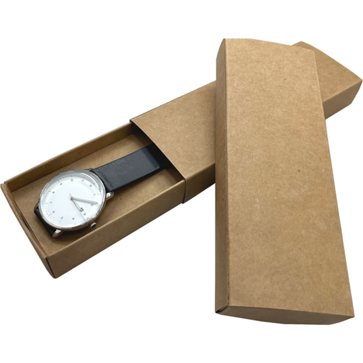 A brown paper watch box, partially opened, revealing a silver watch with a white face and black strap inside.