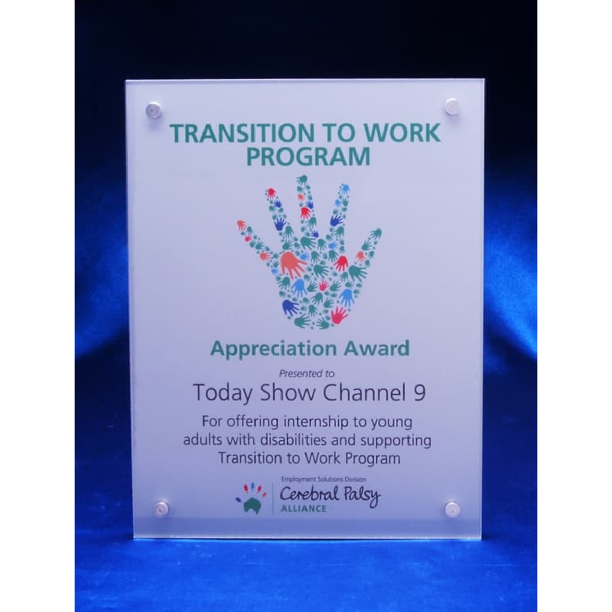 A clear acrylic award plaque featuring a handprint design, presented as an appreciation award.