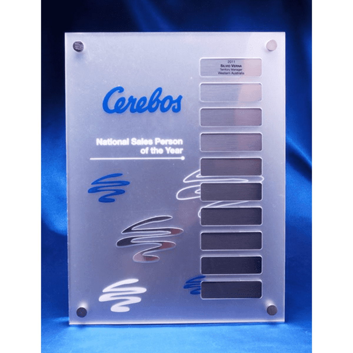 A clear acrylic award featuring removable magnetic plates, with a blue and silver design and a branding logo.