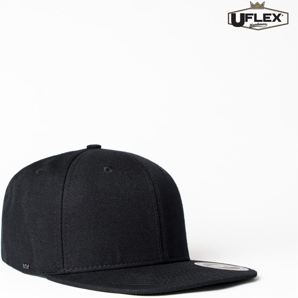 A black flat peak fitted cap with six panels and a logo on the front.