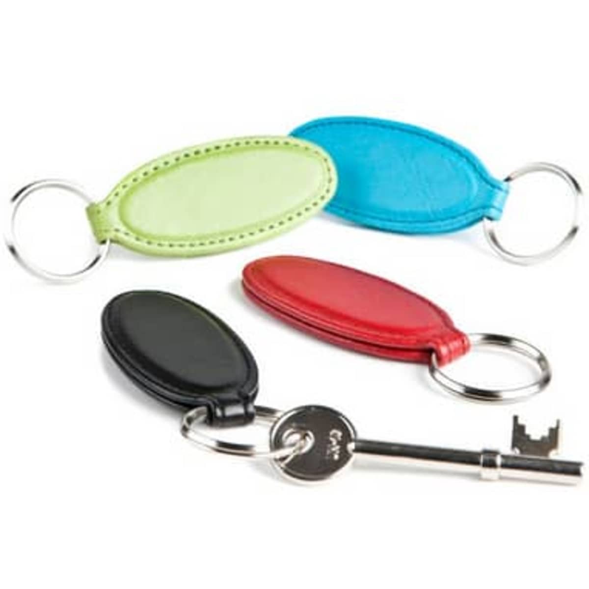 Vivid oval key rings in green, blue, red, and black, featuring metal rings and a textured finish.