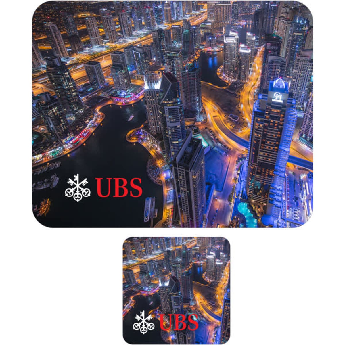 A large blue and black mouse mat with a city skyline design and a smaller matching coaster, both featuring a logo.
