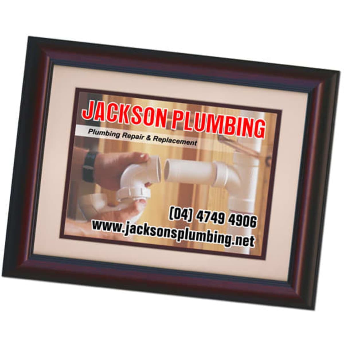 A magnetic photo frame in dark wood, displaying a plumbing service advertisement with a white background.