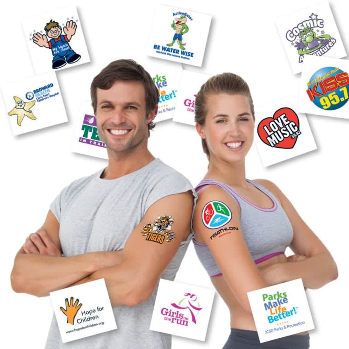 A man and woman smiling, showcasing a variety of colourful temporary tattoos on their arms, with logos in the background.