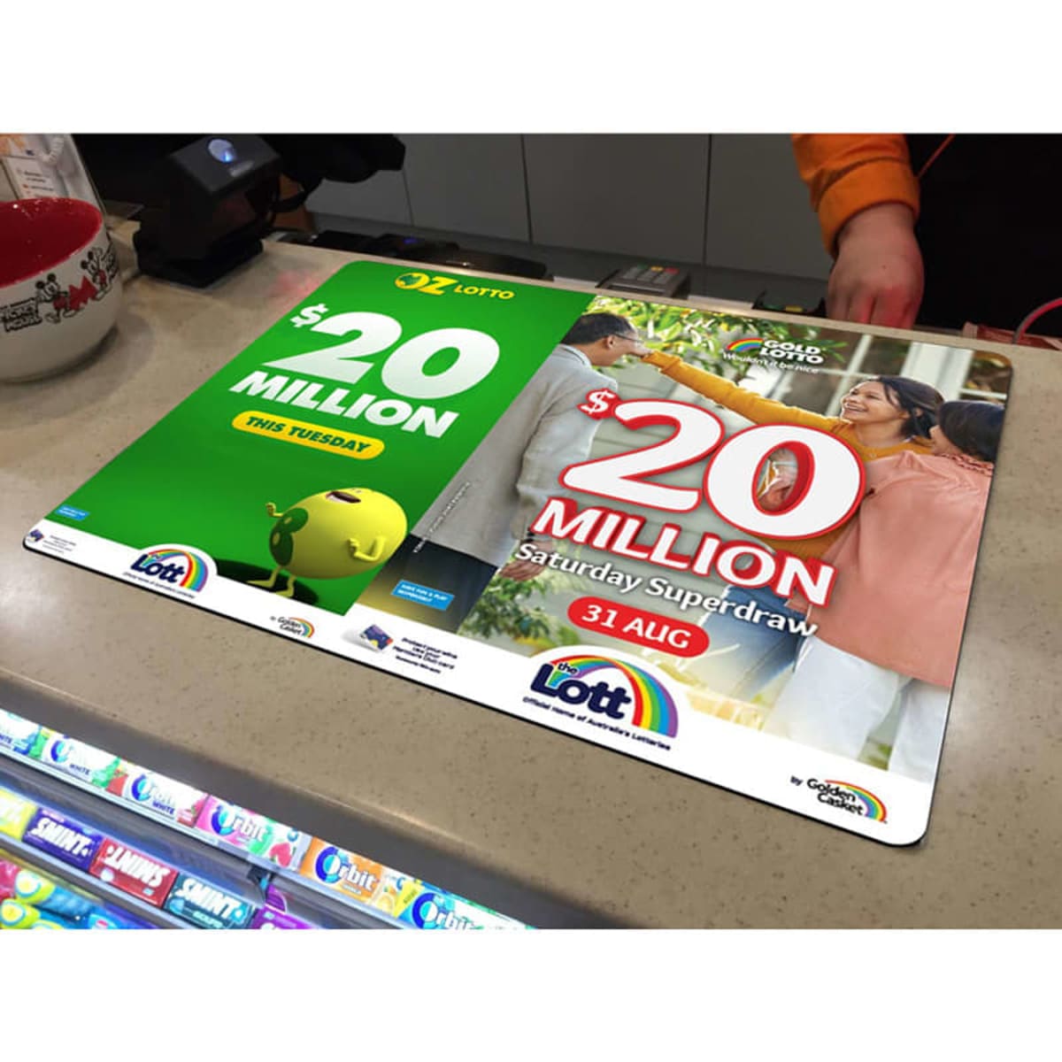 A colourful promotional counter mat featuring vibrant graphics and a logo, suitable for retail displays.