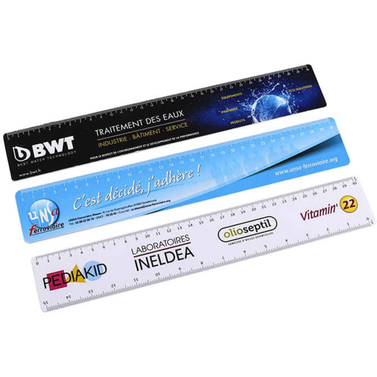 A set of four flexi rulers in black, white, and blue, featuring various logos and branding on each ruler.