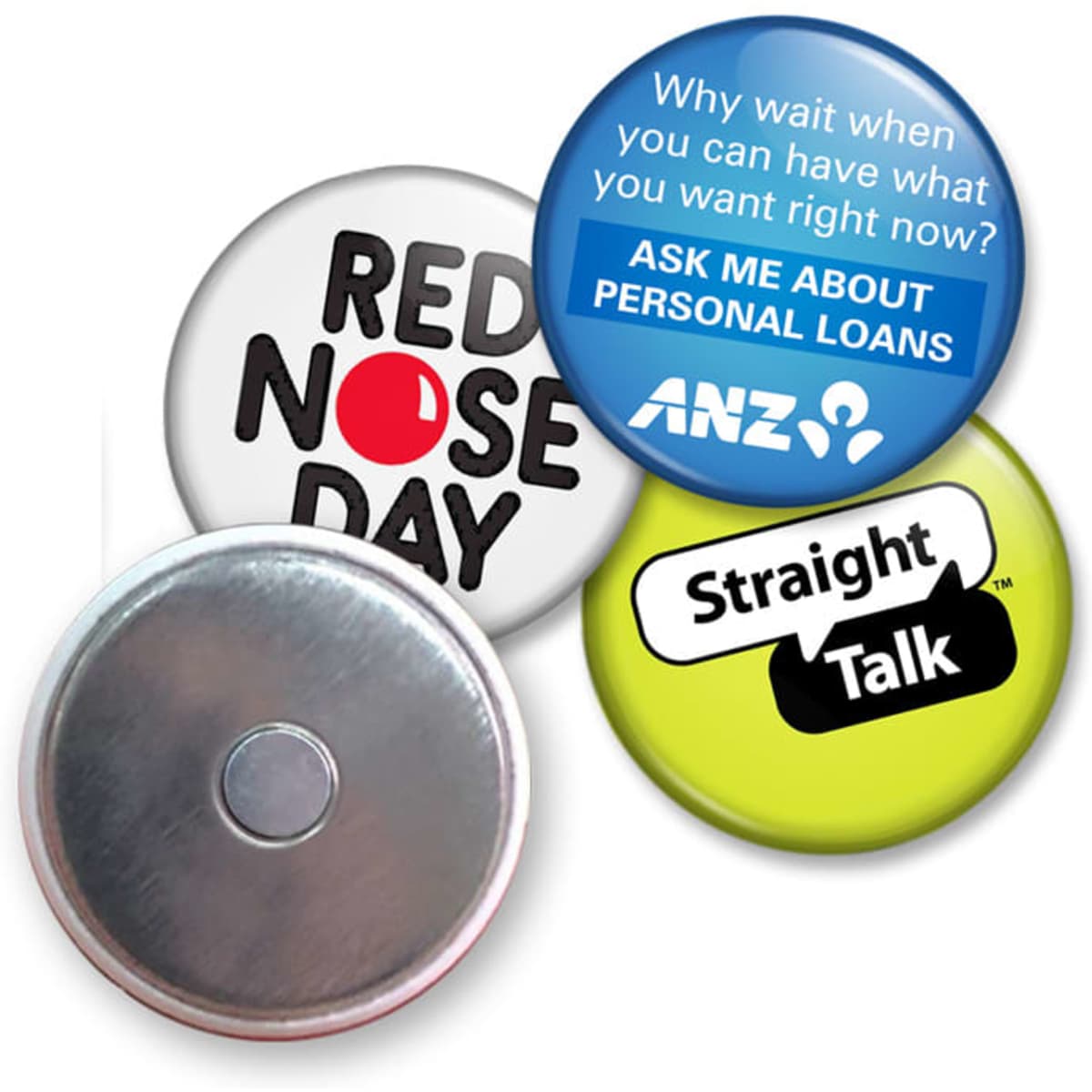A collection of four button badges featuring various colours, designs, and a metallic backing.