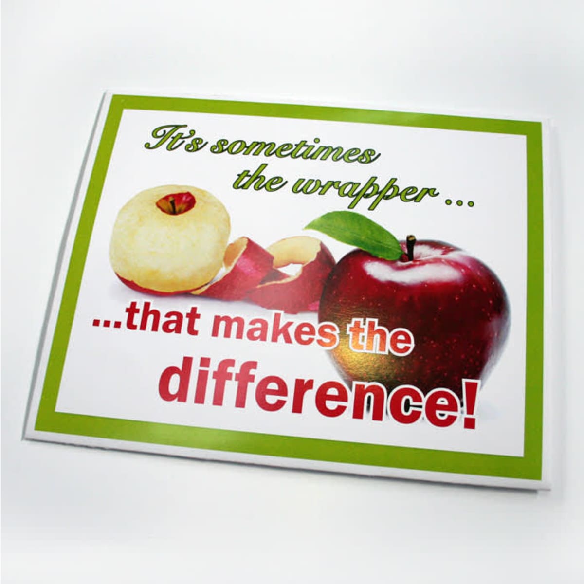 A presentation folder featuring a red and green apple graphic with the text about wrappers, set against a white background.