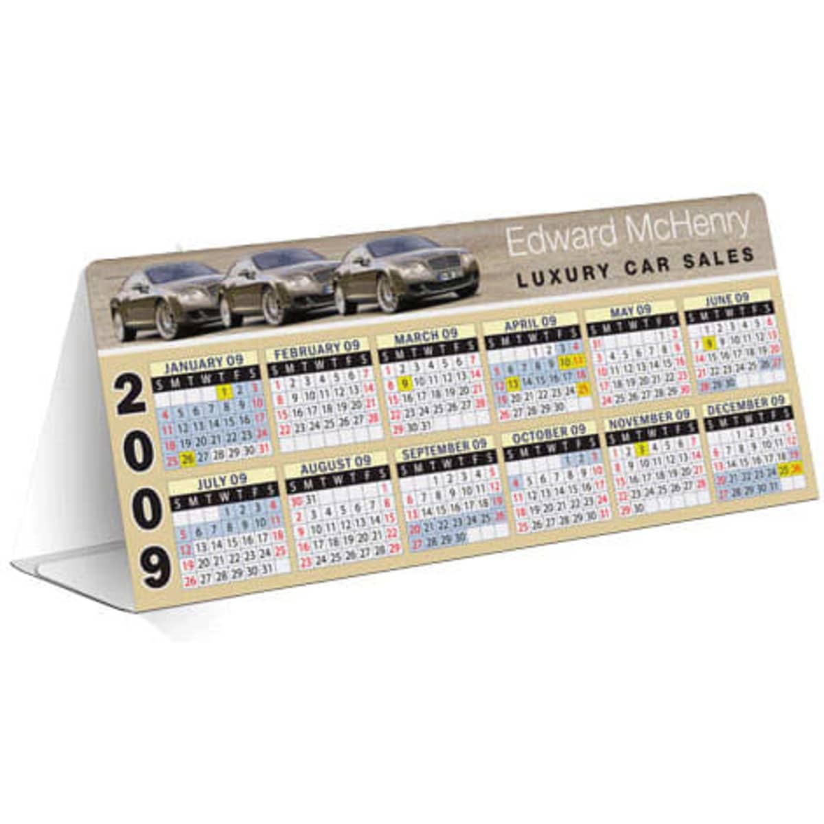 A table tent calendar featuring a car image, displaying the year 2009 with colourful monthly layouts. It has a logo.