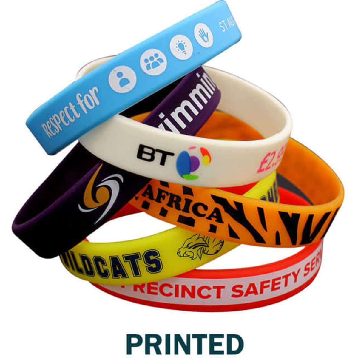 A collection of printed silicone wristbands in various colours, featuring different logos and designs.