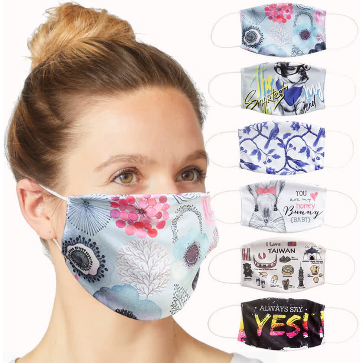 A collection of 2-ply fabric face masks in various patterns and colours, featuring diverse designs and a logo.