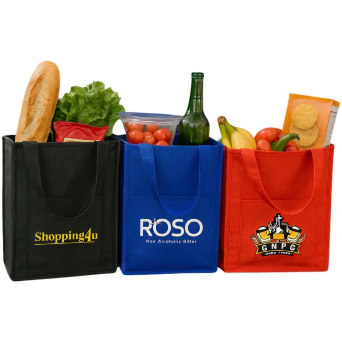 Three insulated grocery totes in black, blue, and red, filled with a variety of groceries including a baguette, drinks, and fruit.