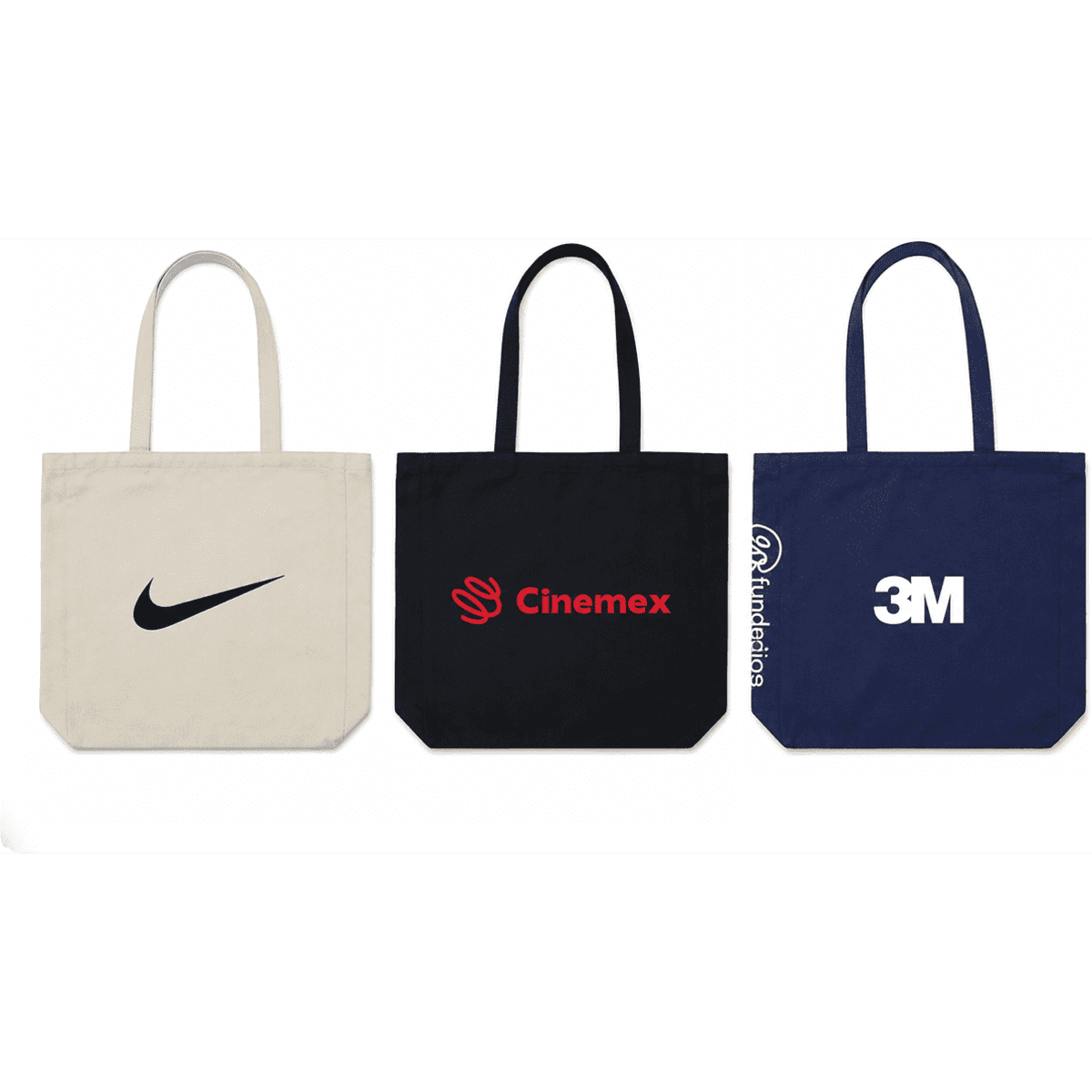 Three tote bags in various colours: a beige bag with a logo, a black bag with a logo, and a navy bag with a logo.