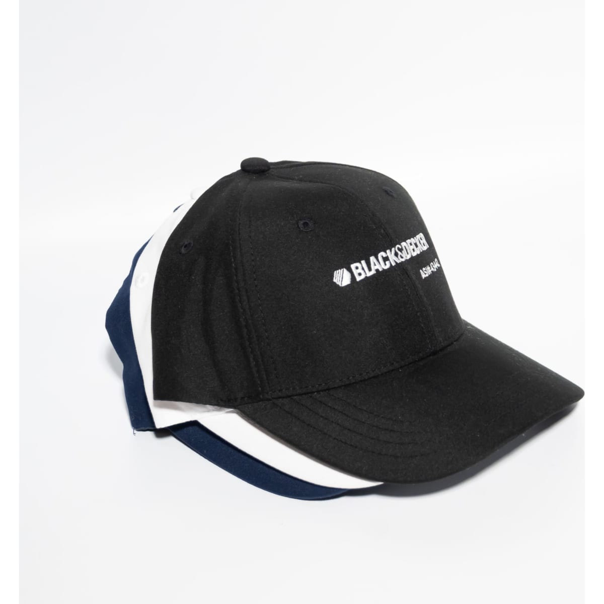 A black baseball cap with a logo, stacked with navy and white versions behind it.