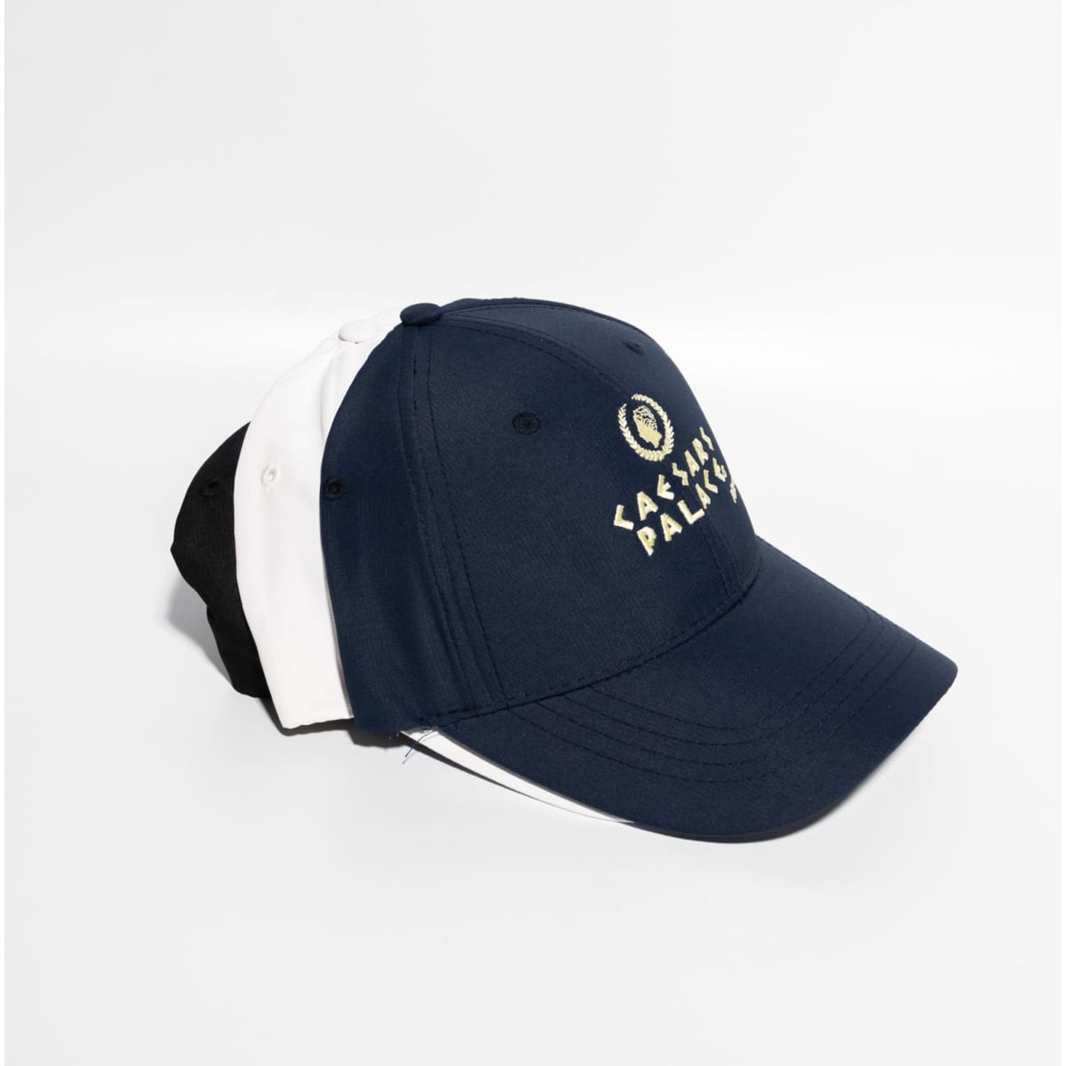 A navy blue and white baseball cap with a Velcro strap, featuring a logo on the front.