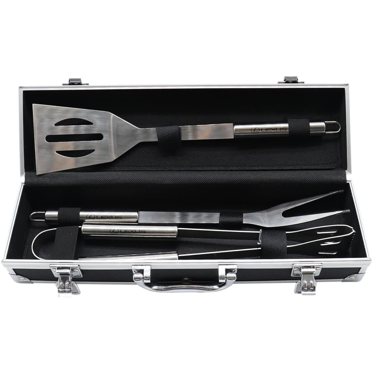 A stainless steel BBQ set with spatula, fork, and tongs in a sleek black deluxe case.