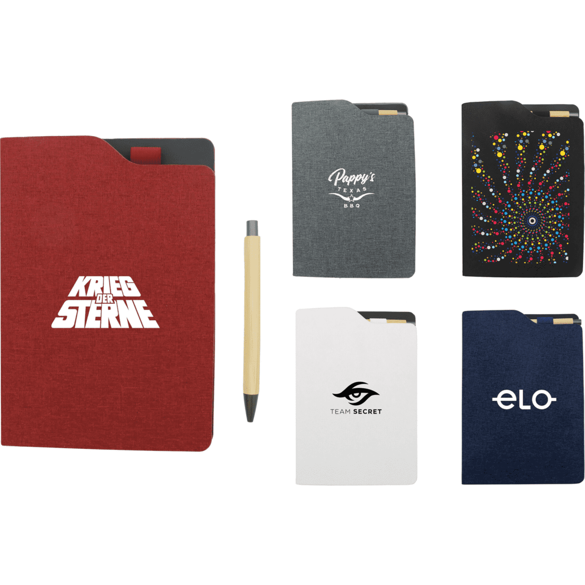 A selection of A5 notebooks in red, black, grey, white, and navy, alongside a beige pen. Each notebook features a logo.