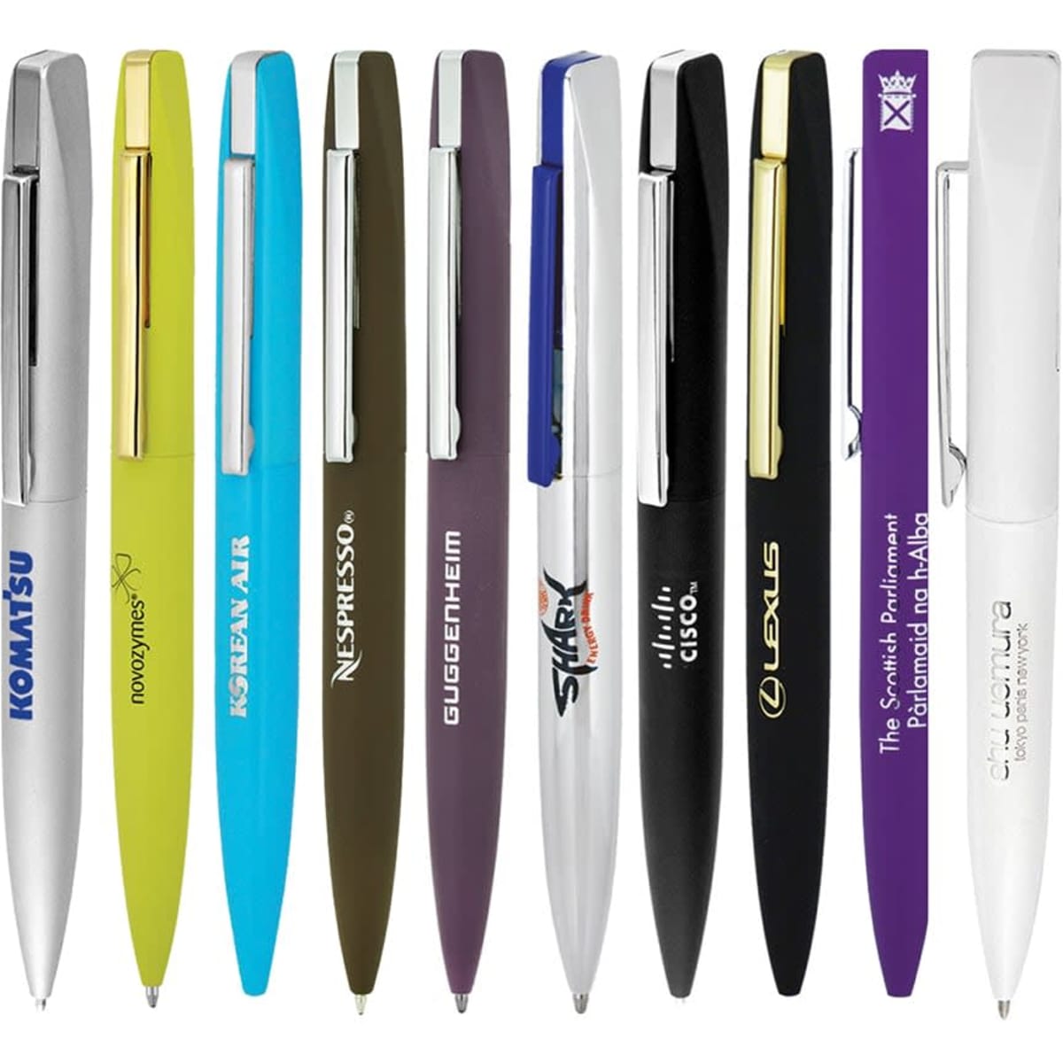 A collection of slim metal ballpoint pens in various colours, featuring multiple brands and a logo on each pen.