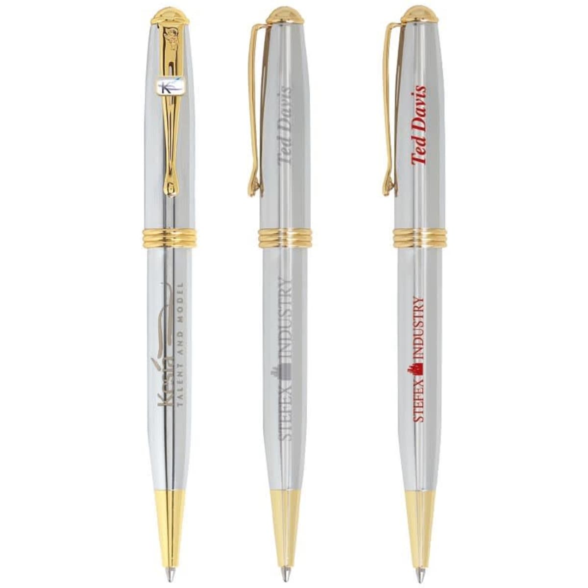 Three metal pens with chrome finishes and gold accents, featuring different logos.
