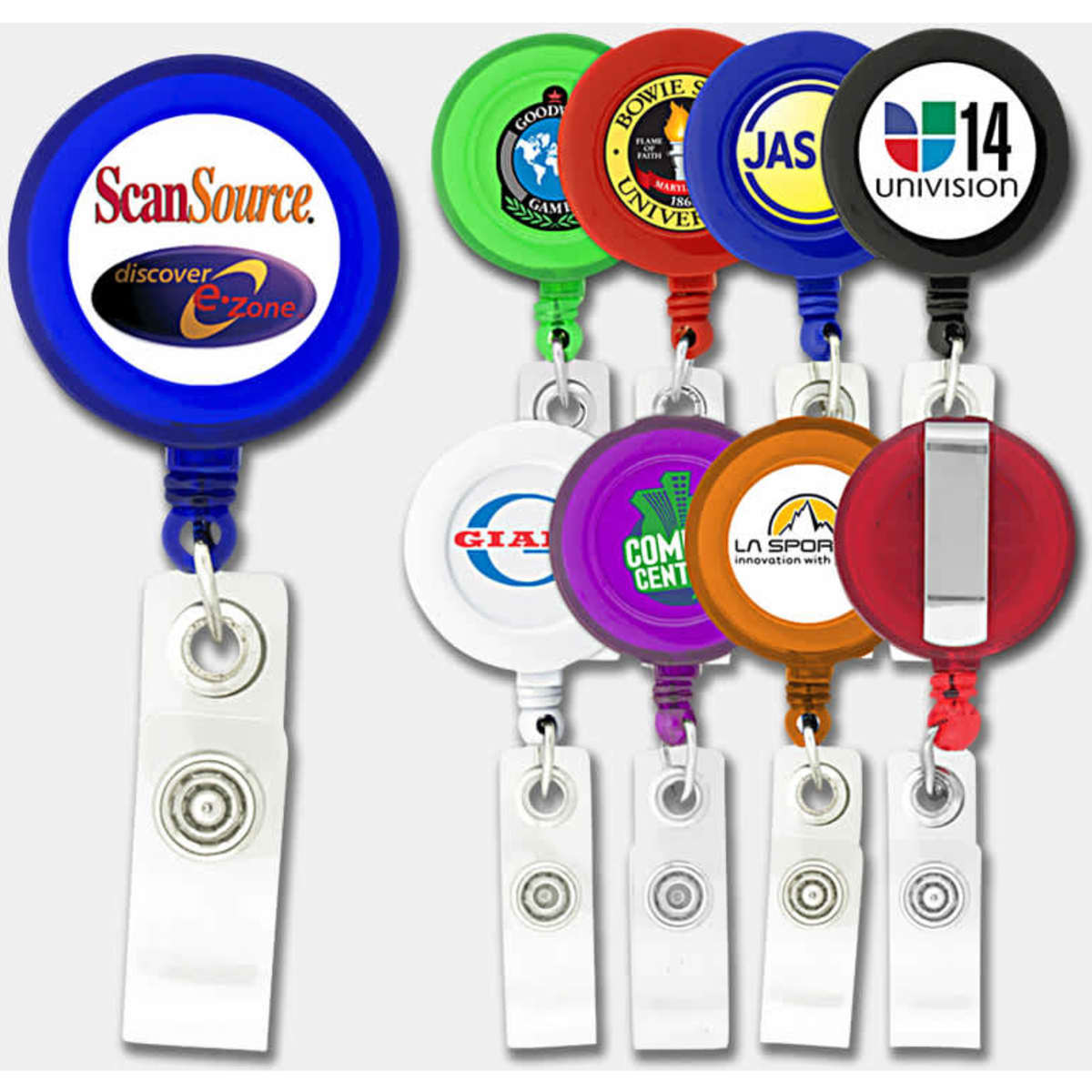 A selection of round badge holders in various colours, each with a logo, attached to a retractable clip.