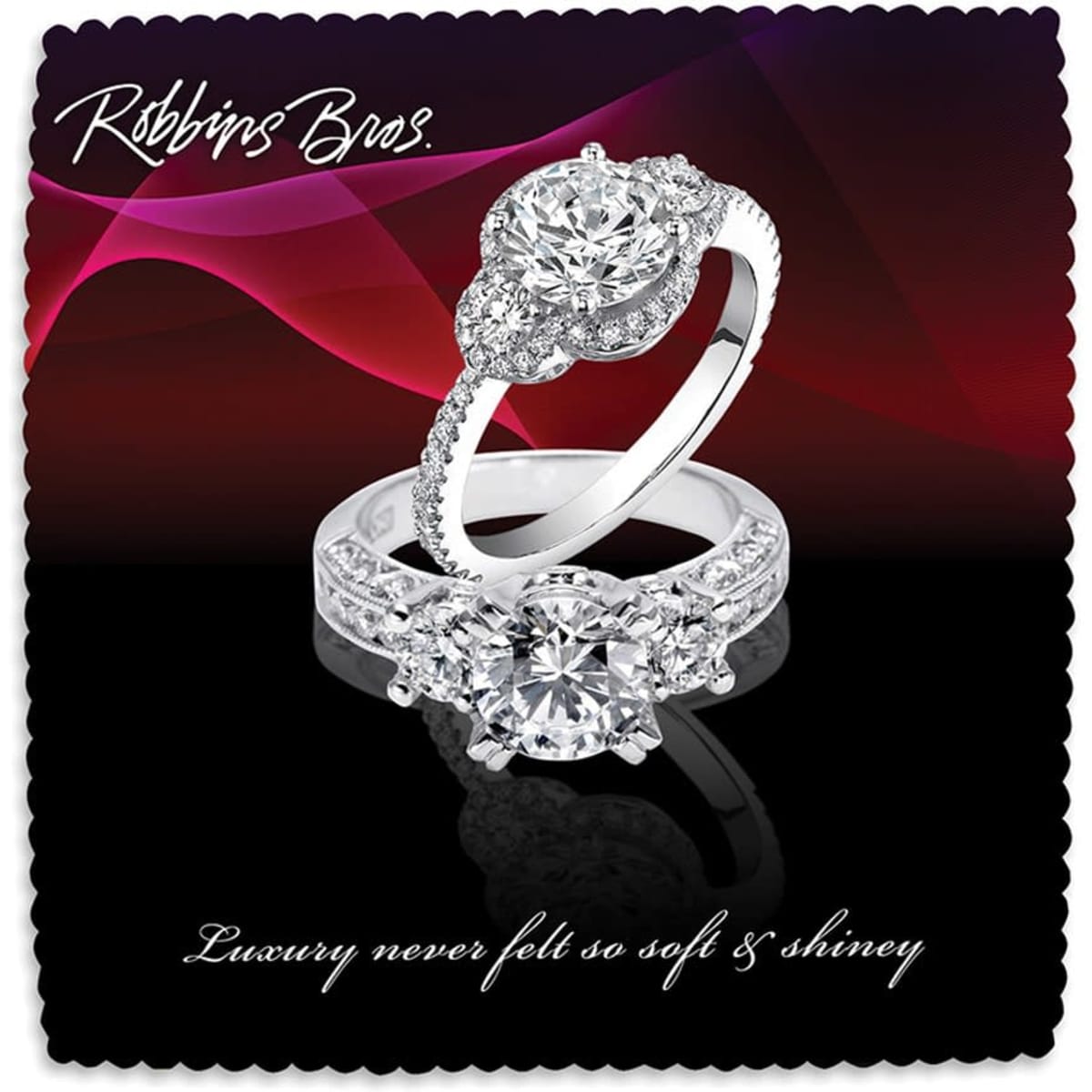 A pair of elegant silver rings adorned with sparkling diamonds, showcased against a dark, wavy background.