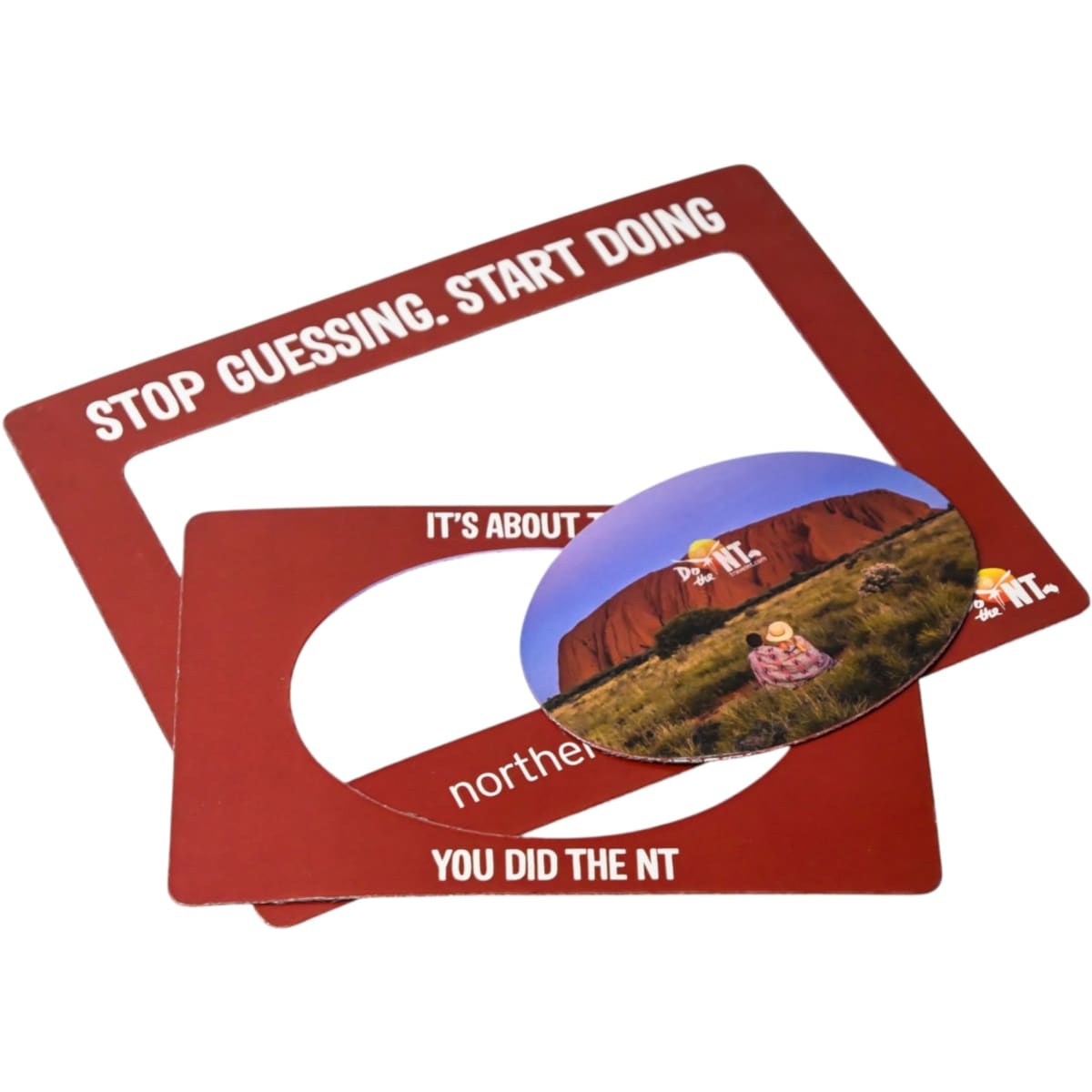 A magnetic photo frame in red featuring a circular cut-out and includes a printed photo.