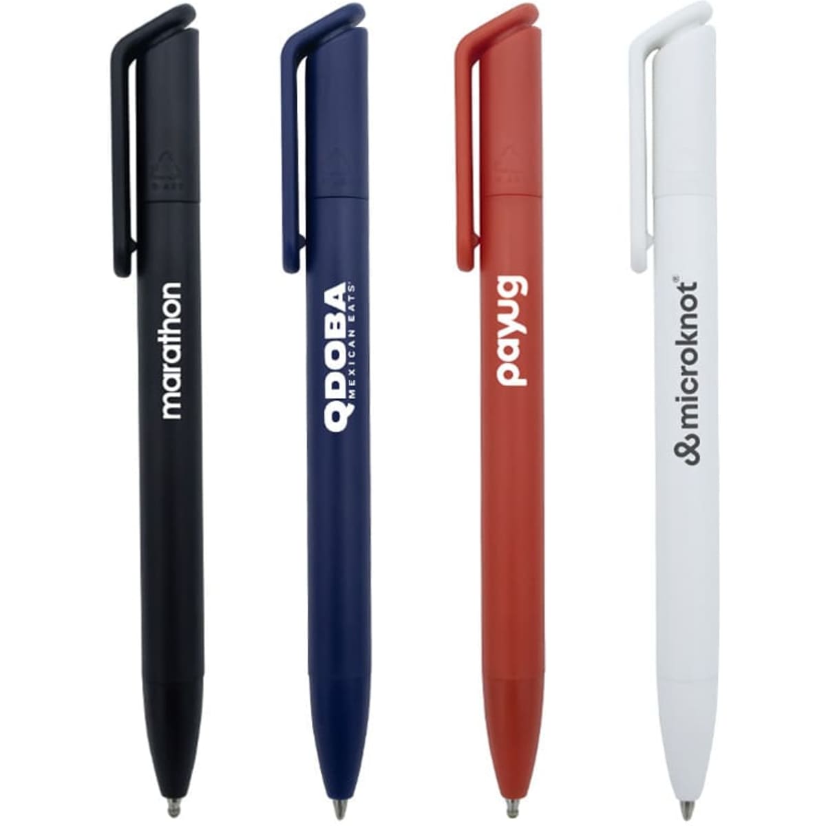Four ballpoint pens in black, navy, red, and white, each featuring a logo on the barrel.