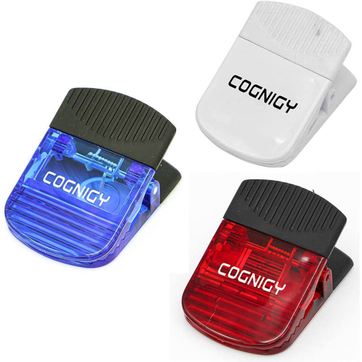 Three plastic magnetic clips in blue, red, and white, featuring a clip design and a logo on each.