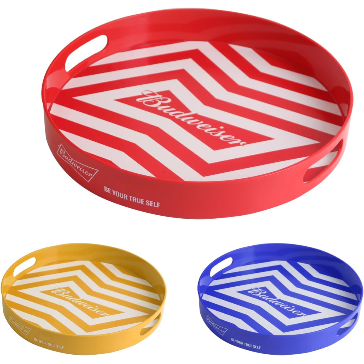 A set of three round serving trays in red, yellow, and blue with geometric patterns and handles. Each tray features a logo.