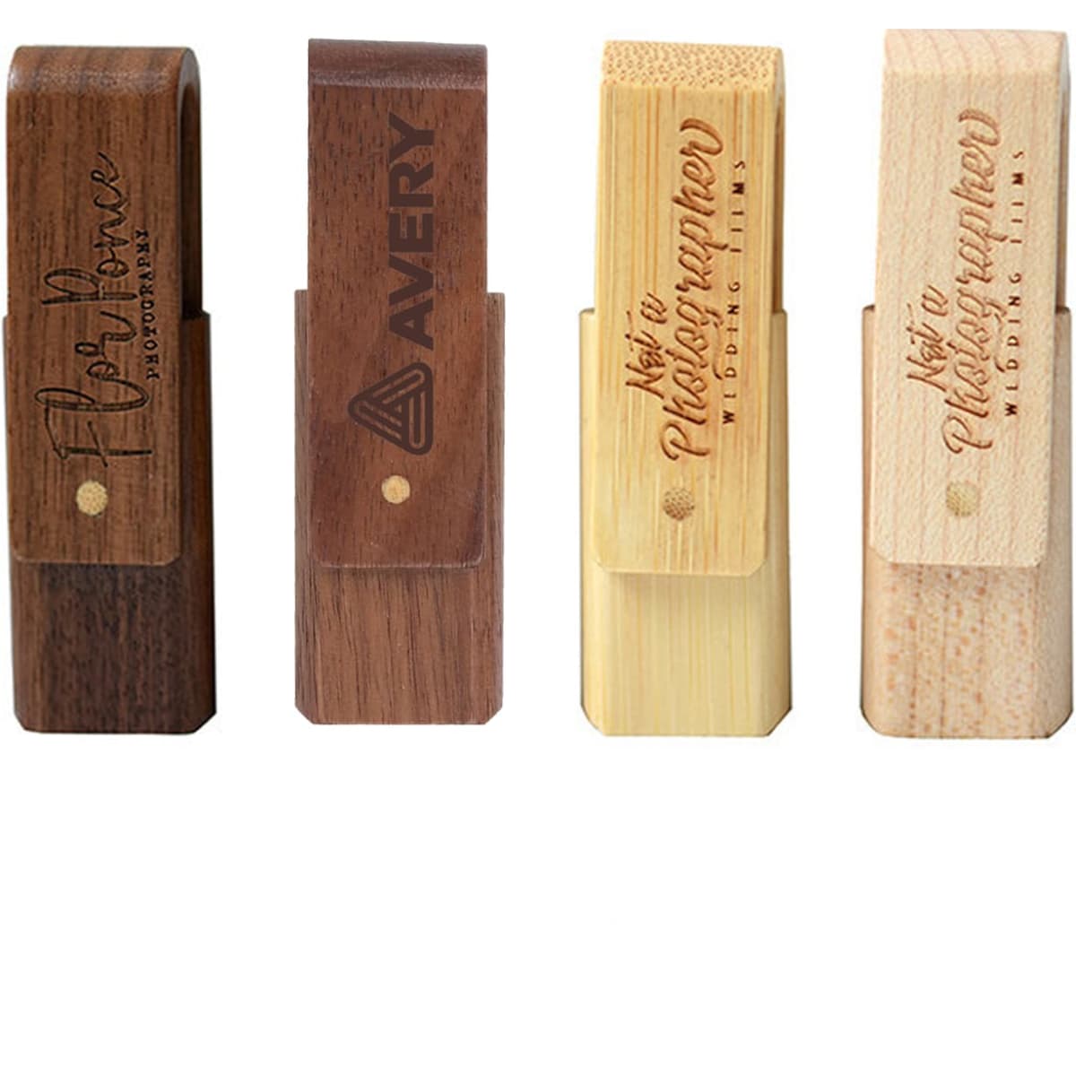 A collection of four wooden flash drives in various finishes, featuring different textures and engraved logos.