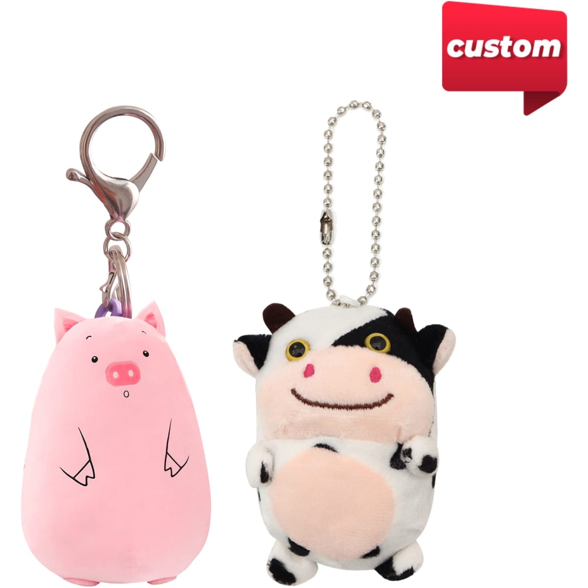 Two custom animal keyrings, featuring a pink pig and a cow, with metal clasps and a ball chain.