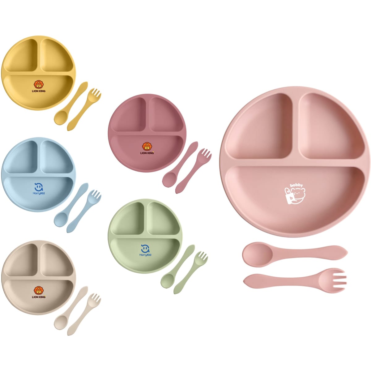 A set of silicone kids suction plates in pastel colours, featuring divided sections and accompanying utensils.
