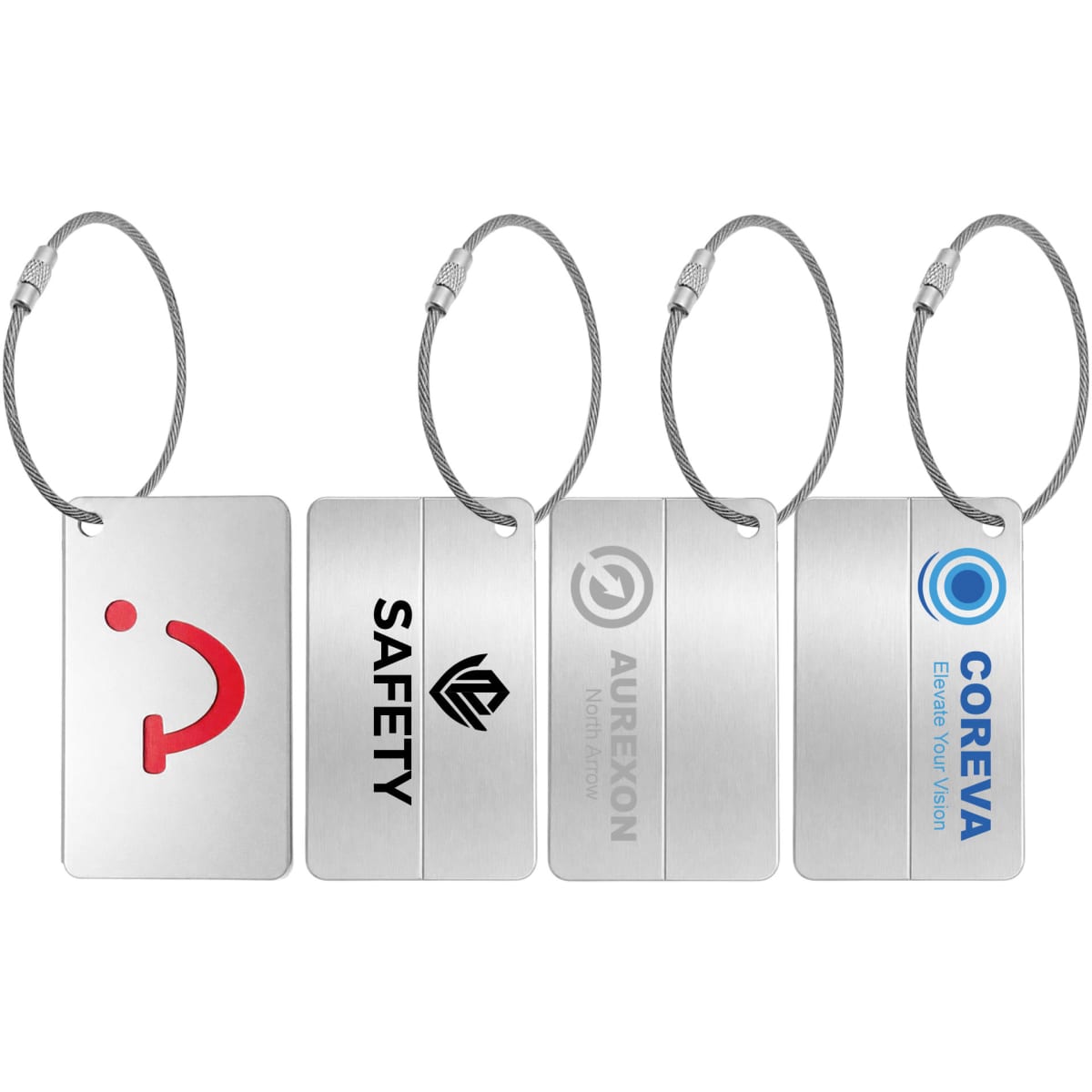 Four metal luggage tags with silver finishes, featuring various shapes and logos, attached to wire loops.