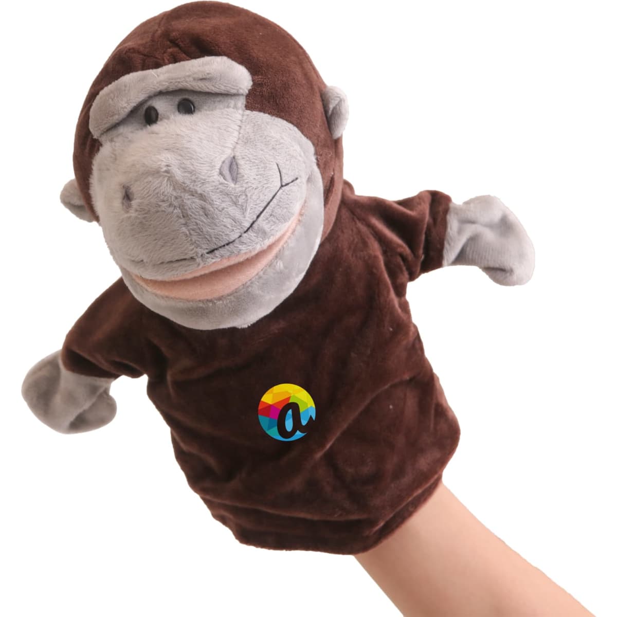 A brown plush monkey hand puppet with grey accents and a logo on its chest.