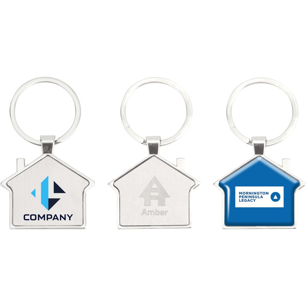 A collection of three metal house-shaped keyrings in silver and blue, featuring different branding designs.
