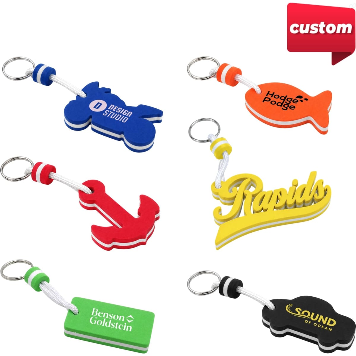 A selection of colourful custom EVA floating keychains, featuring various shapes like a horse, fish, anchor, and text designs.