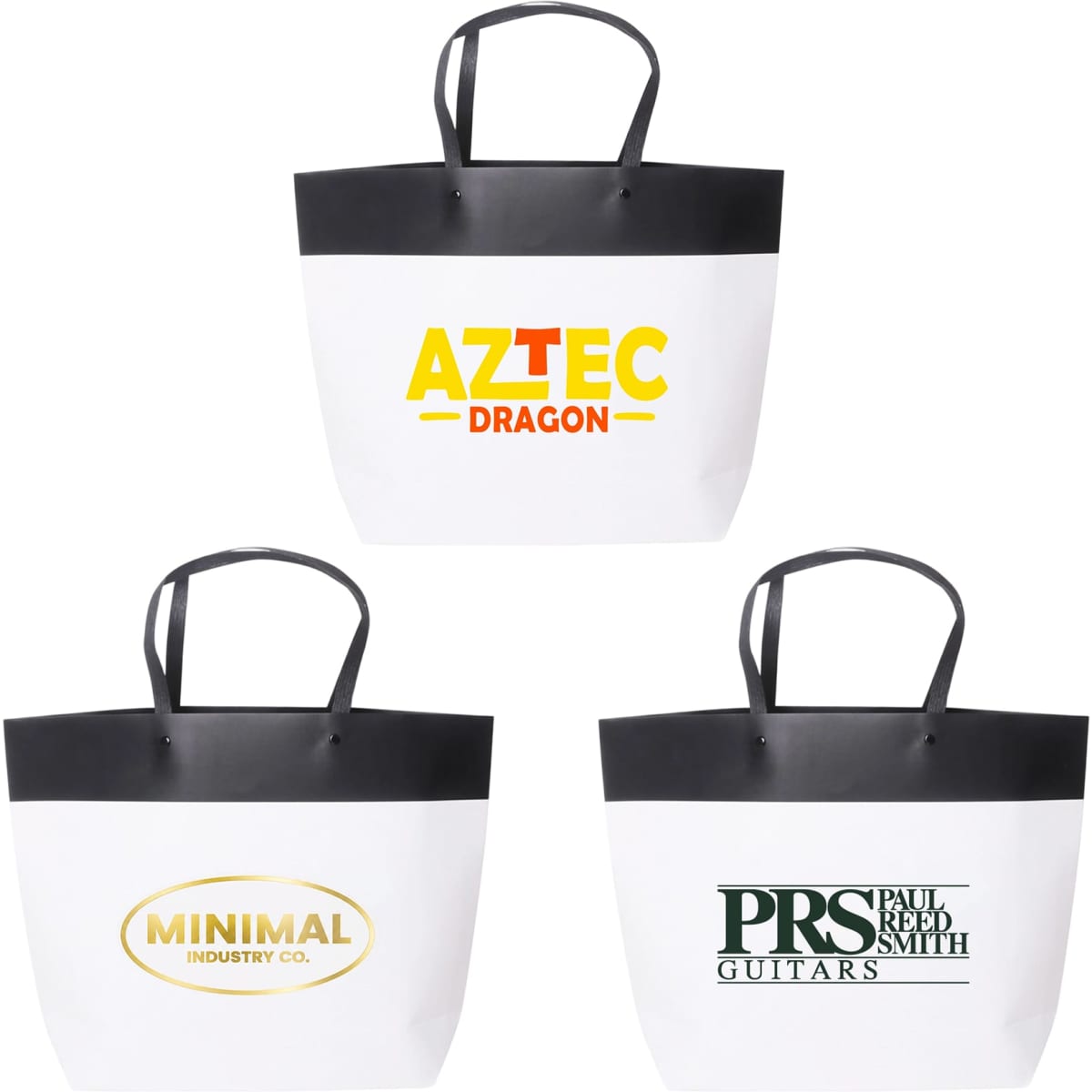 Three small black and white paper bags with black handles, featuring different logos on the front.