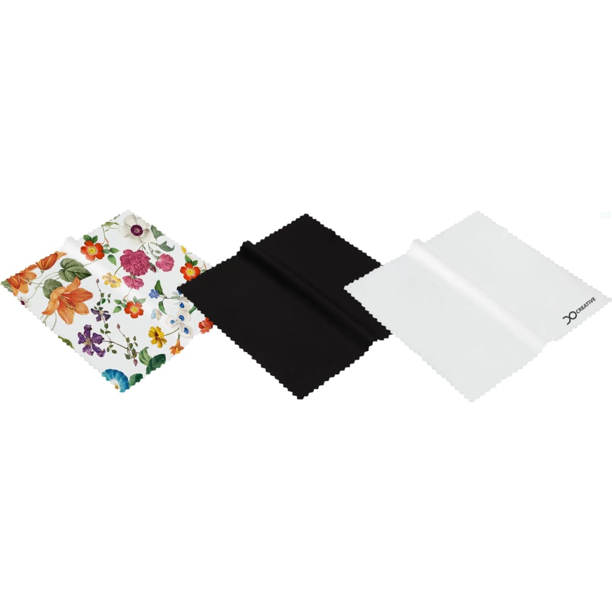 A set of three RPET lens cloths in floral, black, and white designs, featuring varied textures and shapes.
