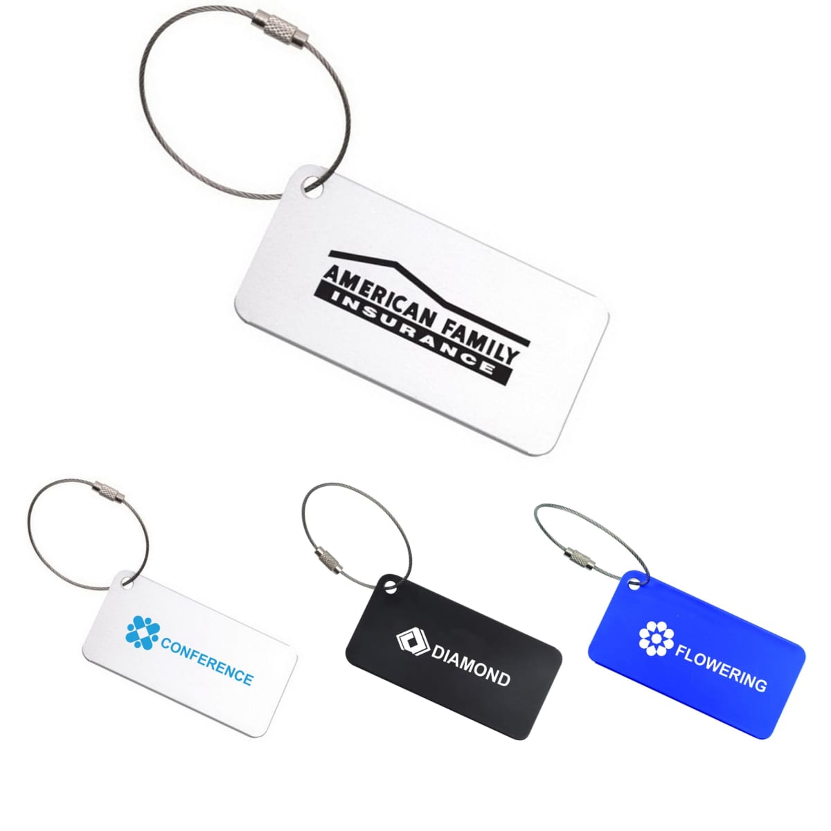 A collection of square aluminium luggage tags in white, black, and blue, each with a metal loop and branding.