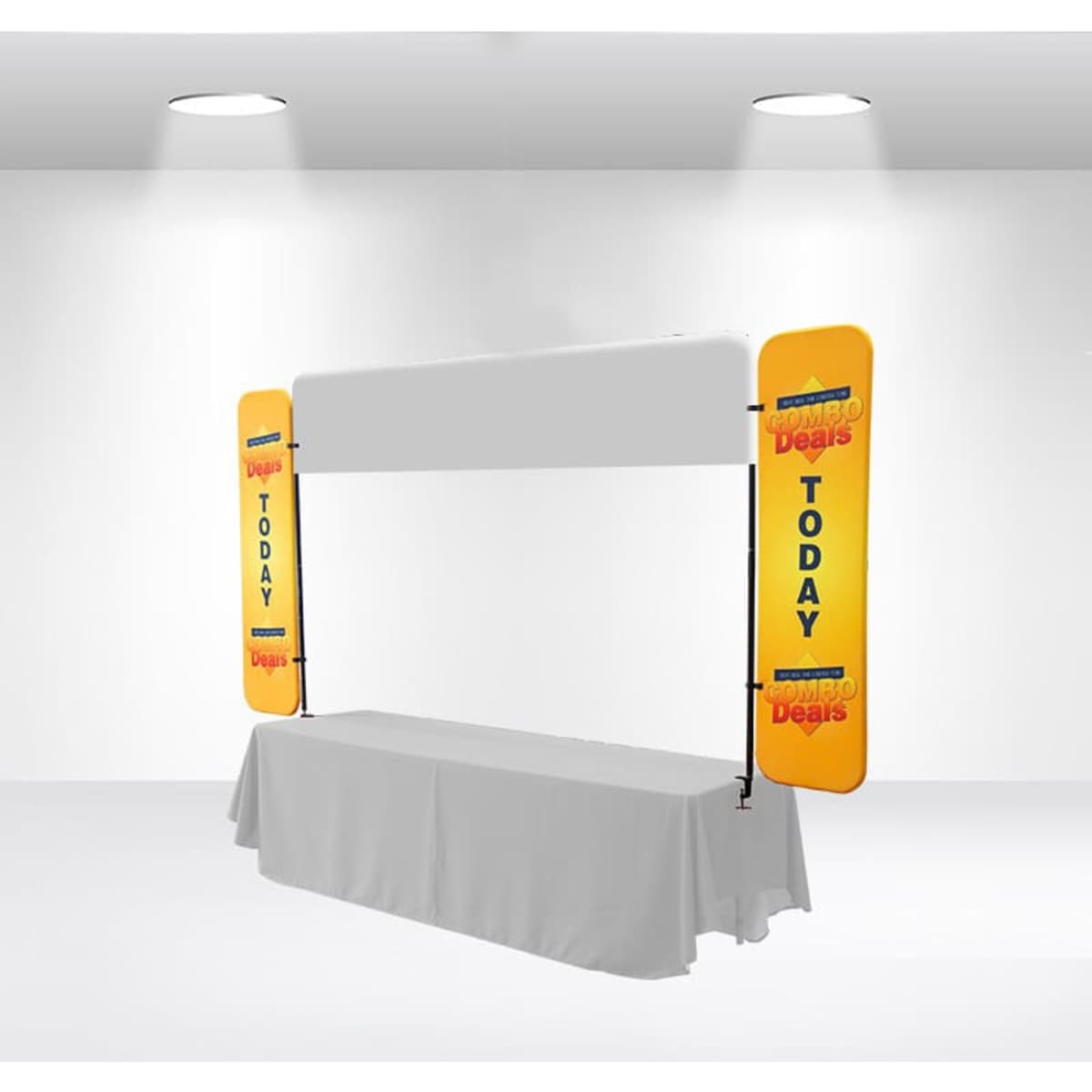 A table top banner with yellow side panels and a blank central area, set up in a bright indoor space.