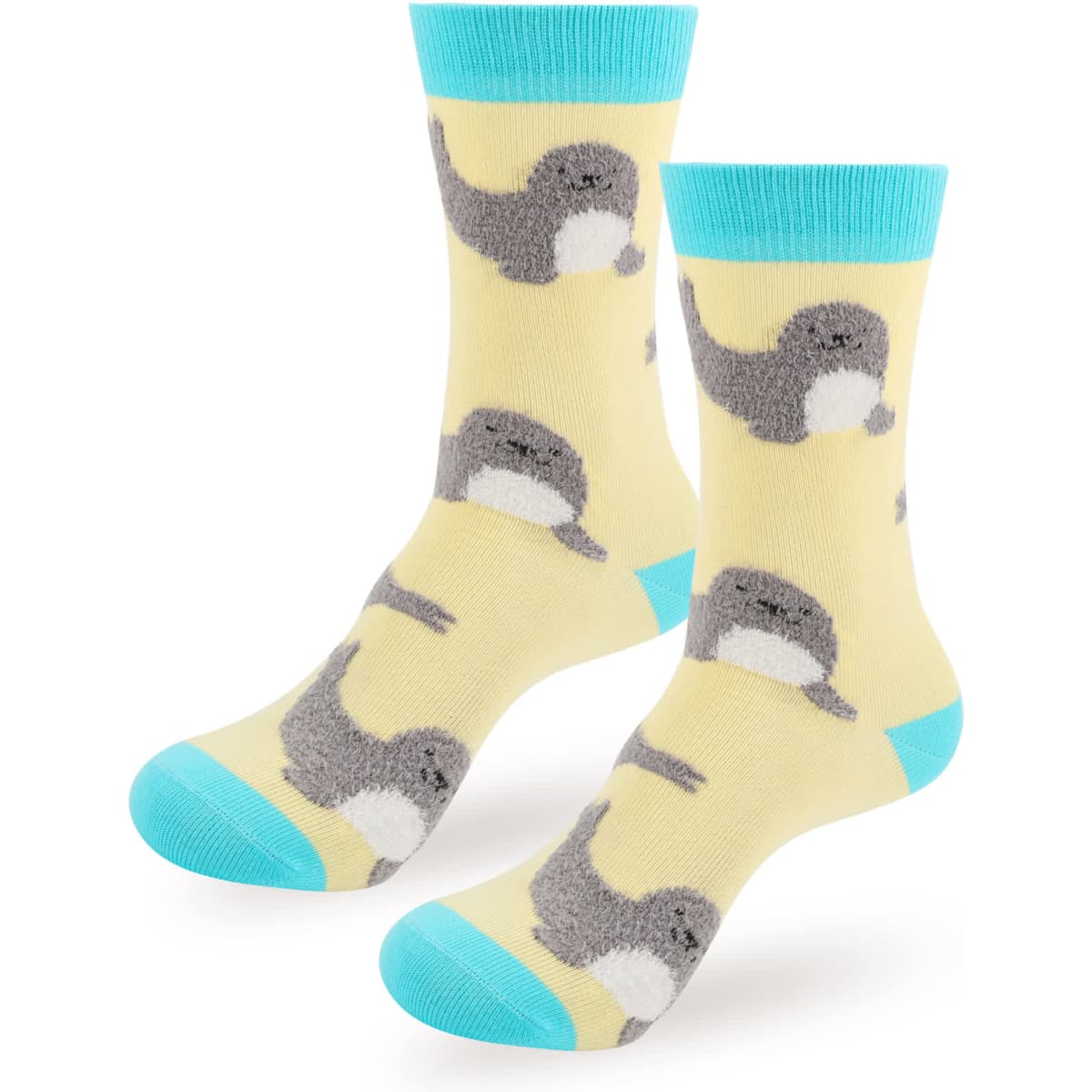 Woven socks featuring a playful design of grey and yellow narwhals on a light yellow background with turquoise accents.