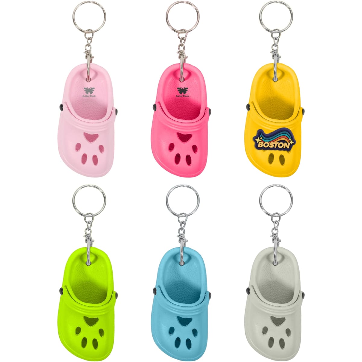 A keyring featuring mini clog shoes in pink, yellow, green, blue, and grey, with a logo on one.