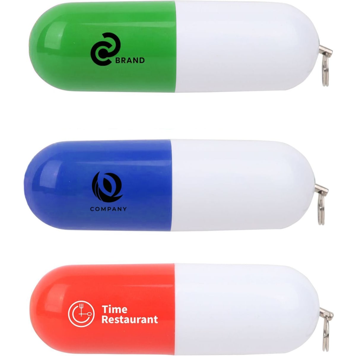 Three pill-shaped flash drives in green, blue, and orange. Each features a logo on a white background.