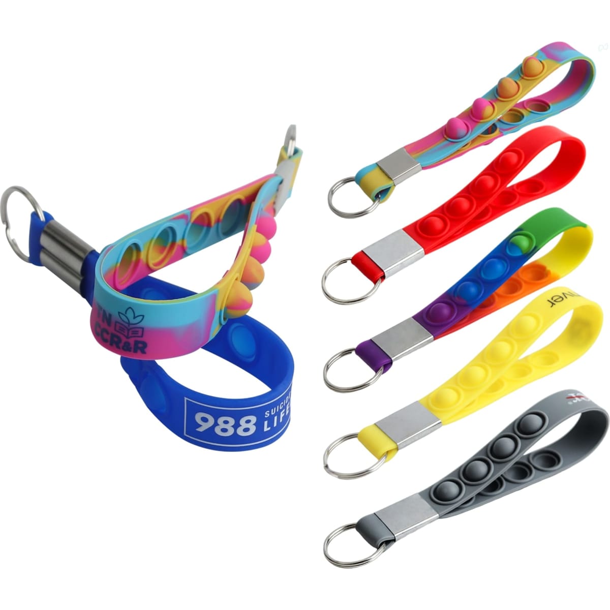 A set of colourful popper stress reliever keyrings in various colours, including rainbow, red, yellow, and grey.