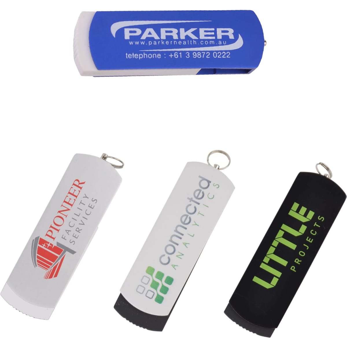 Four flash drives in blue, white, grey, and black, each featuring a different logo, with a keyring attachment.