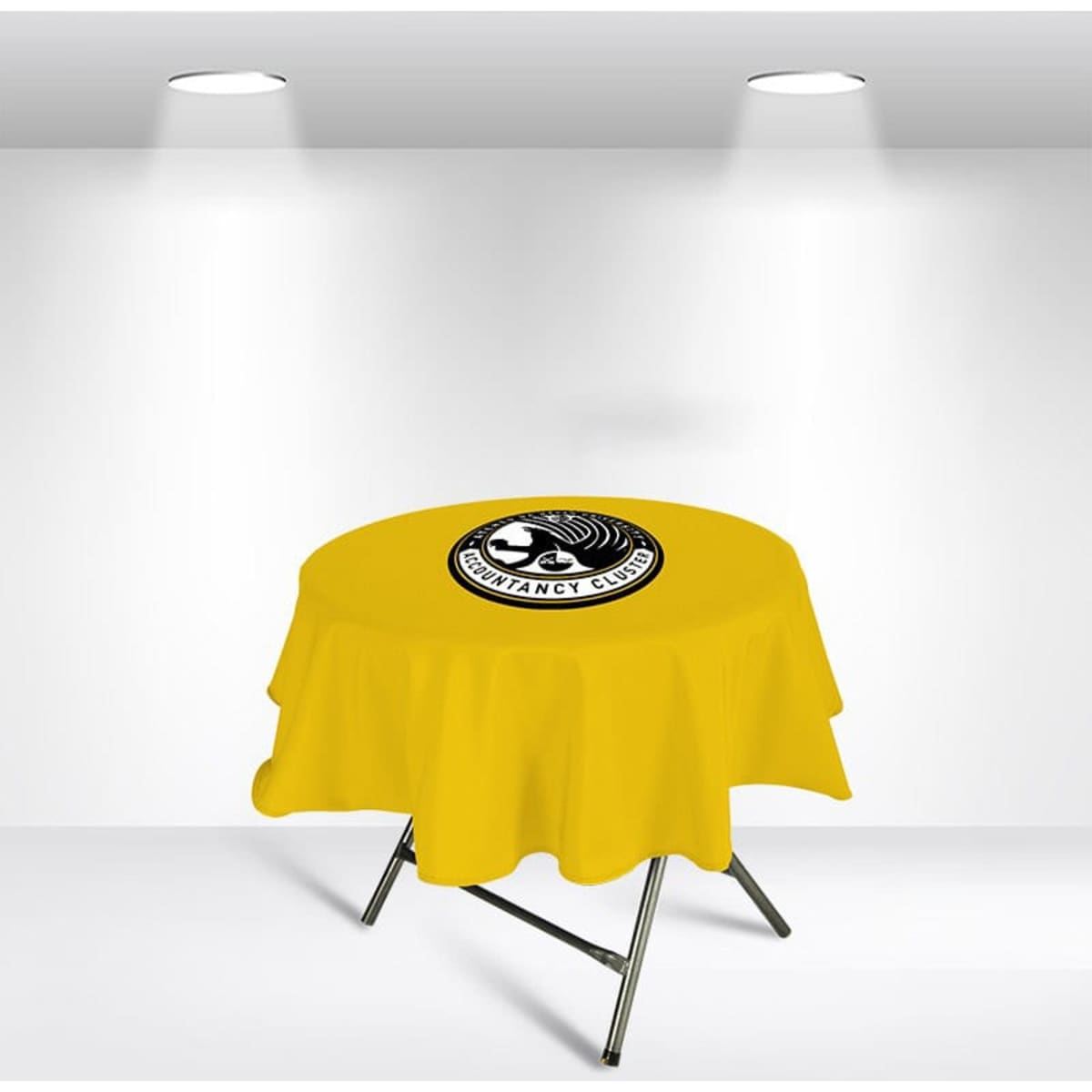 A round table cover in vibrant yellow featuring a logo in the centre, displayed under bright lights.